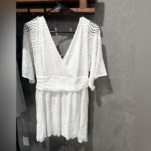 New with tags 
Never worn 
Has built in shorts